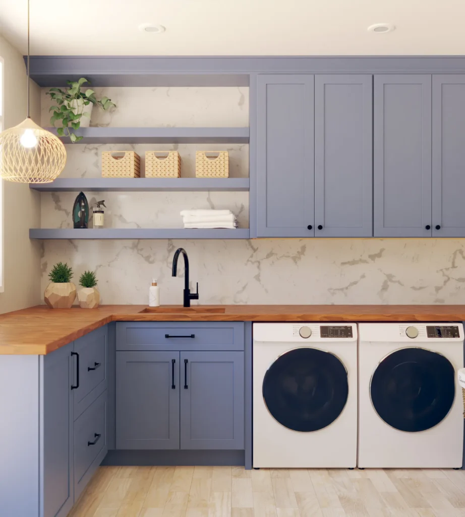 Laundry room with blue-grey Fabuwood cabinets, butcher-block counter, marble backsplash and front-load washer and dryer