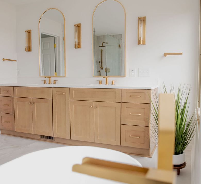 Natural oak double vanity with arched mirrors
