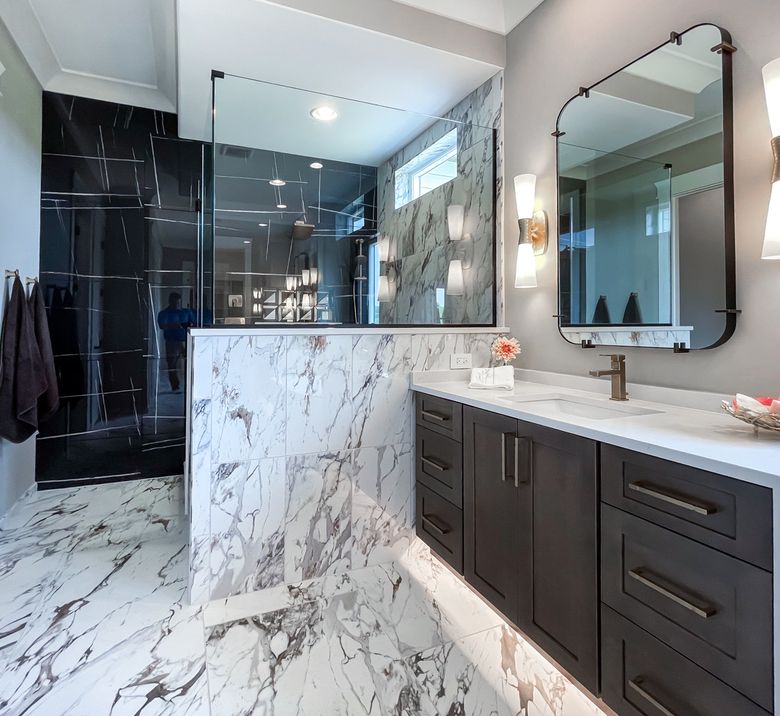 Warm wood vanity with marble surround