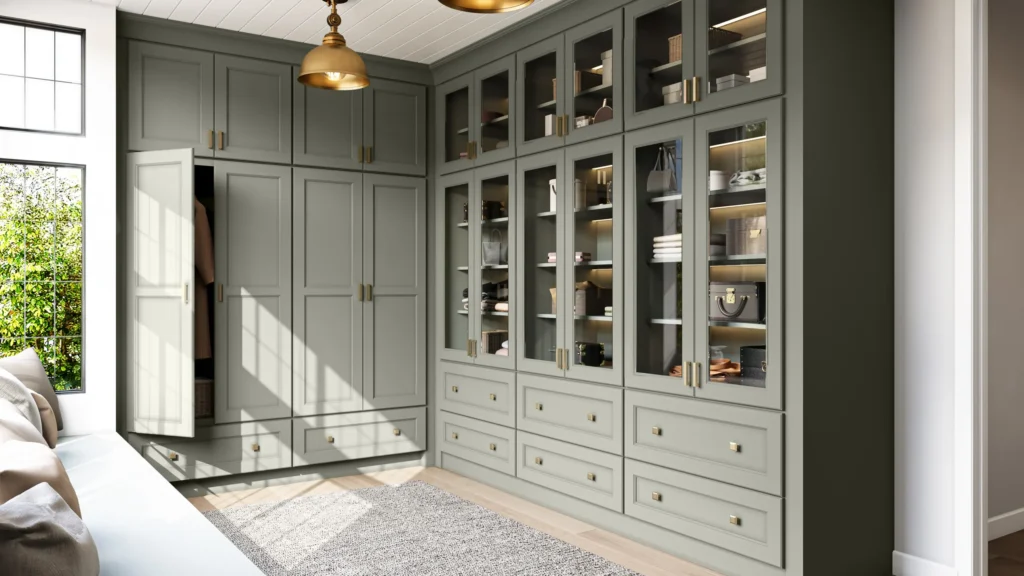 Sage green built-in cabinets with glass doors